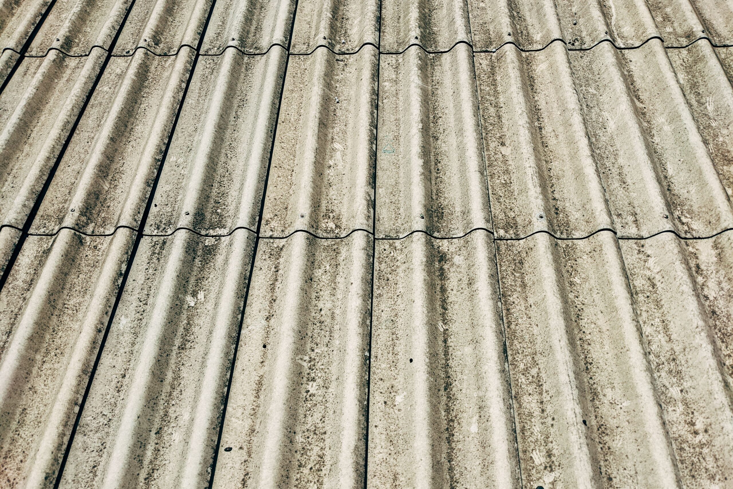 Detailed close-up of a corrugated concrete roof showcasing texture and pattern.